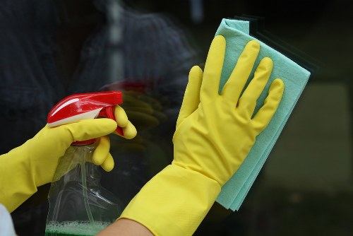 Cleaner working through a regular home cleaning checklist in TW8